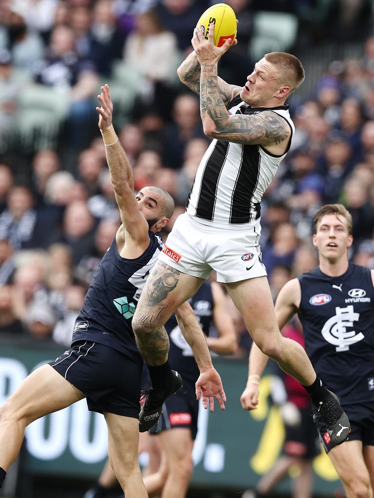 Jordan De Goey rises over Adam Saad to mark in Round 23. Picture: Michael Klein