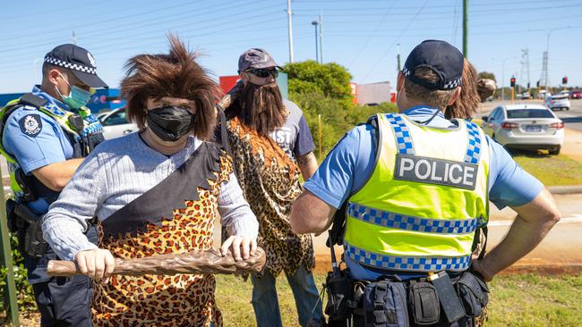 Cavemen outside Bunning greet the PM. Picture: Jason Edwards