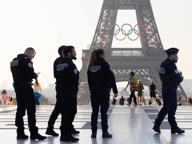 Officers of the French National Police patrol in front of the Eiffel Tower. Picture: AFP