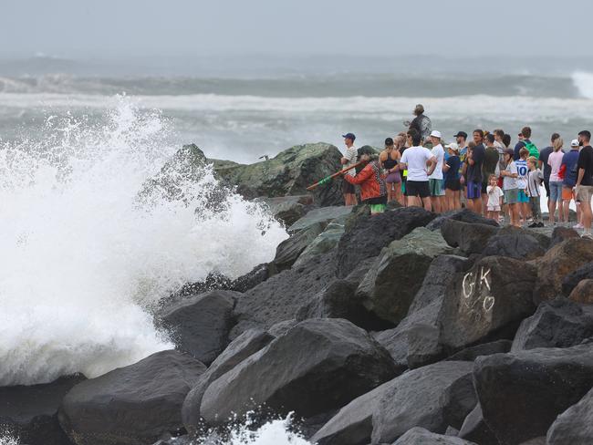 Thousands of people are out and about to watch the swell at Kirra as Cylone Alfred sits off the coast. Pics Adam Head