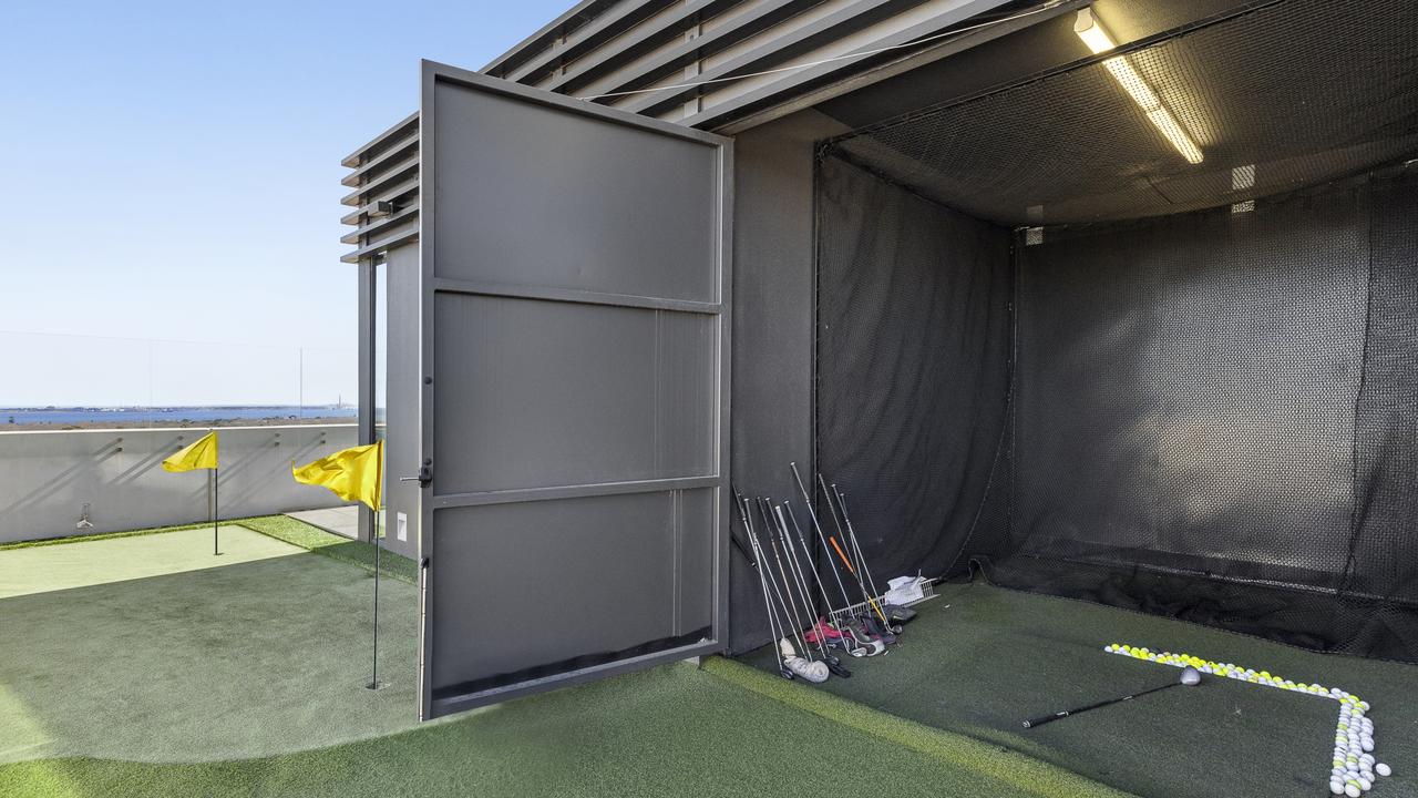 The indoor golf driving facility, on the penthouse’s rooftop.