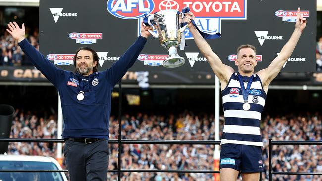 Chris Scott and Joel Selwood lift the premiership cup. Picture: Michael Klein