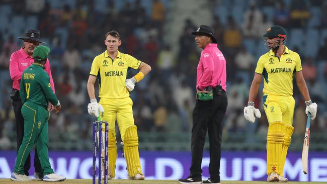 Marcus Stoinis and Marnus Labuschagne of Australia interacts with Temba Bavuma of South Africa and Match Umpires Richard Illingworth and Joel Wilson after the third umpire decision. Picture: Getty Images