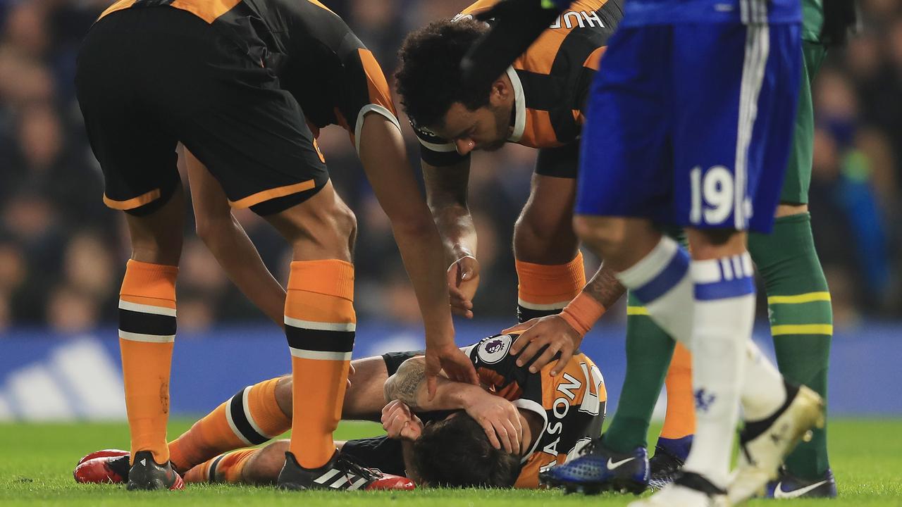 Ryan Mason lies injured after the collision with Gary Cahill.