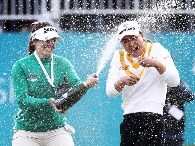 GYEONGGI-DO, SOUTH KOREA - OCTOBER 22: Minjee Lee of Australia is doused with champagne by Hannah Green of Australia after beating Alison Lee of the United States in a playoff during the final round of the BMW Ladies Championship on the Seowon Hills course at Seowon Valley Country Club on October 22, 2023 in Gyeonggi-do, South Korea. (Photo by Chung Sung-Jun/Getty Images) *** BESTPIX ***