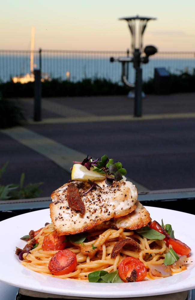 Spaghetti anchovies with barramundi fillet at The Rustic Olive, overlooking the ocean at Redcliffe. Picture: AAP Image/David Clark.