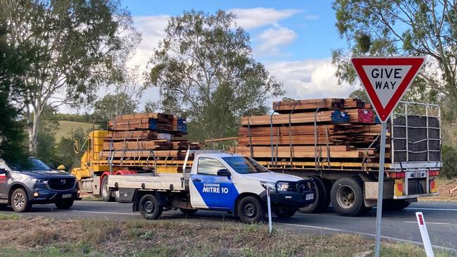 The timber truck is blocking one lane on Mary Valley Rd.