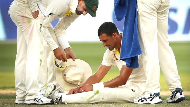 Starc cracks open a delicious, cold pickle juice. (Ryan Pierse/Getty Images)