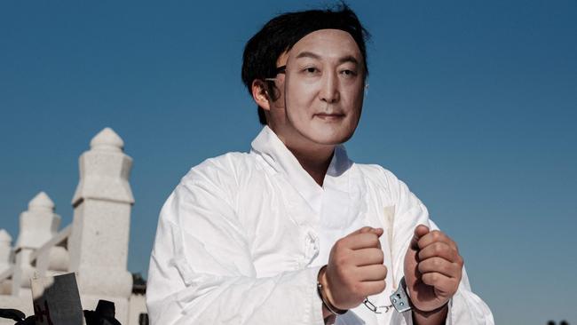 A protester wears a mask of impeached South Korean President Yoon Suk Yeol before starting a January 11 rally against him in Seoul. Picture: AFP