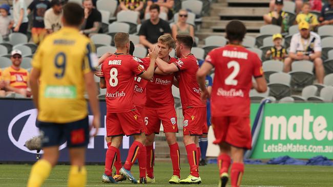 Adelaide United celebrate Ben Halloran’s goal against Central Coast. Picture: Ashley Feder/Getty Images.