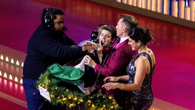 Pro-Palestine protesters are taken away by security after interrupting the Carols by Candlelight concert in Melbourne on Christmas Eve. Picture: AAP