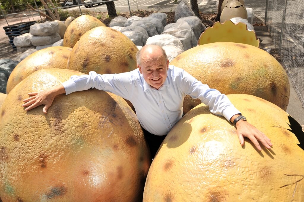 Bill Schoch, general manager at Palmer Coolum Resort, poses with recently delivered dinosaur eggs that will form part of the resort's new exhibition. Photo: Iain Curry / Sunshine Coast Daily. Picture: Iain Curry