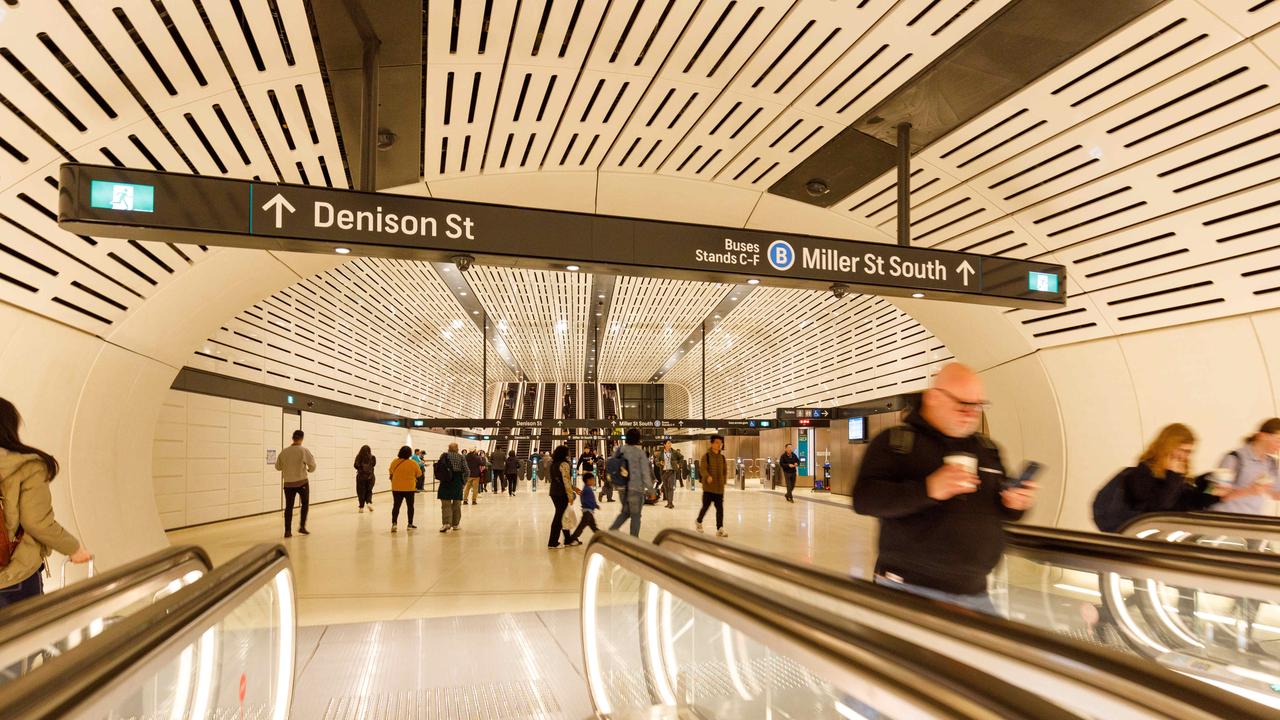 Commuters at Victoria Cross Metro station on the opening day of the Sydney Metro. The new Metro stations boast capacious spaces and public art. Picture: NewsWire / Max Mason-Hubers