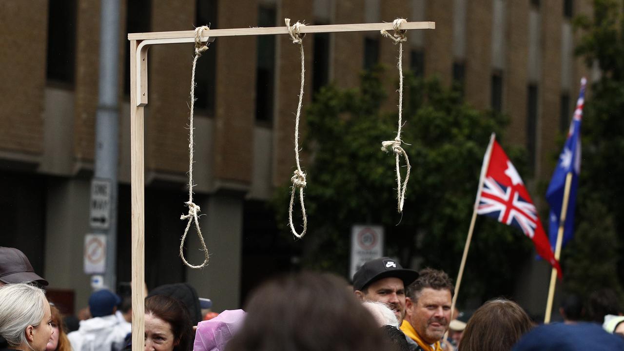 A gallows with nooses is seen in Melbourne during a rally against the state government's proposed pandemic laws. Picture: Daniel Pockett / NCA NewsWire