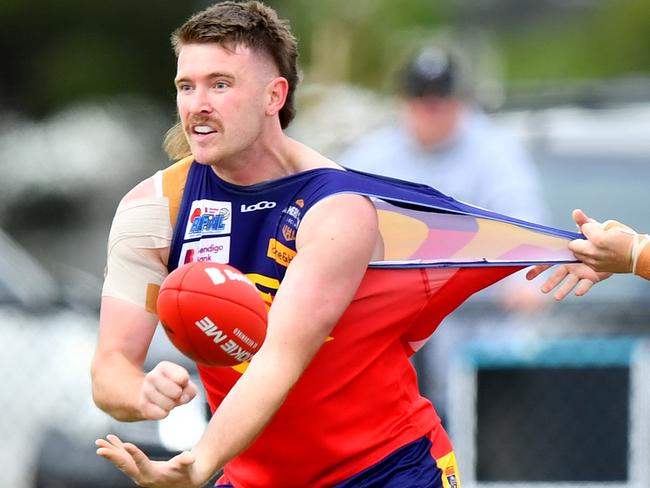 Mitchell Day of Diggers Rest is tackled by Owen Fowler of Wallan during the round two RDFNL Bendigo Bank Seniors match between Diggers Rest and Wallan at Diggers Rest Recreation Reserve, on April 13,2024, in Diggers Rest, Australia. (Photo by Josh Chadwick)