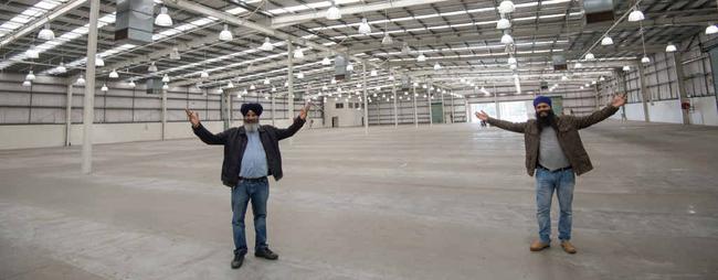 NEW FACILITY: Oz Groups’ Kamaldeep Singh Clair and Kulwinder Singh Bajwa at the old Bunnings building. Picture: Trevor Veale