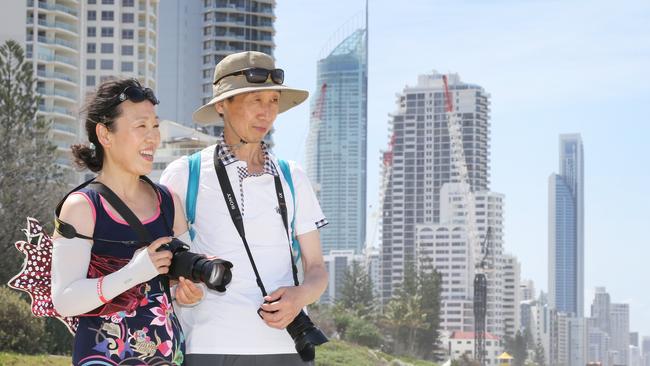 Chinese tourists Liu Weihong and Zhao Weiguo on the Gold Coast. Pic: Glenn Hampson