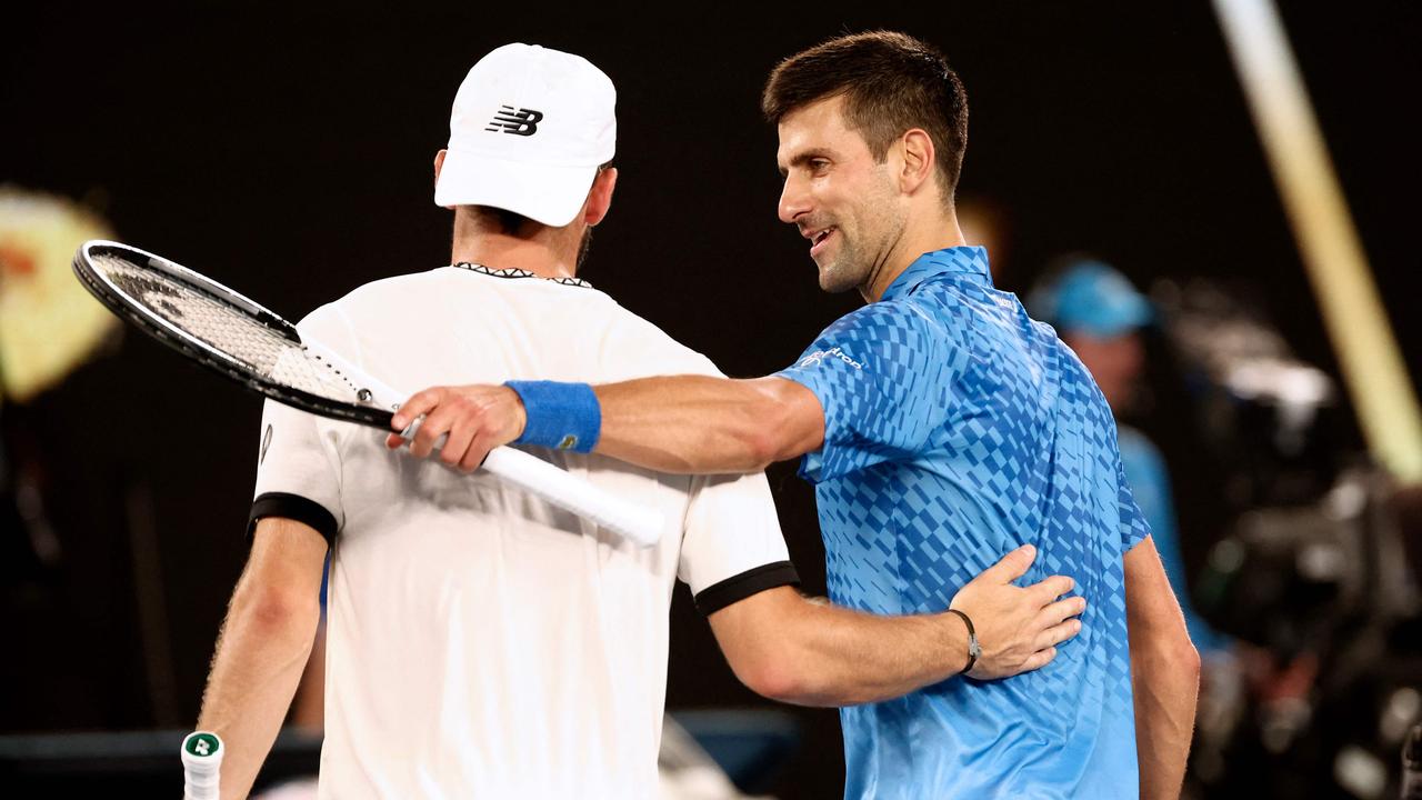 Novak Djokovic embraces Tommy Paul after the semi-final.