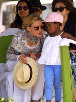 Madonna with adopted daughter Mercy James in 2010. Picture: AFP/Amos Gumulira