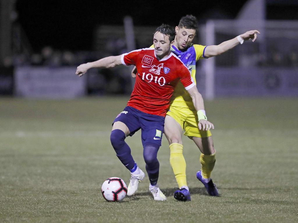 Lokoseljac Cup Final at KGV. Devonport Strikers versus South Hobart. South Hobart's Loic Feral, left, and Devonport's Joel Stone, battle for the ball. Picture: PATRICK GEE