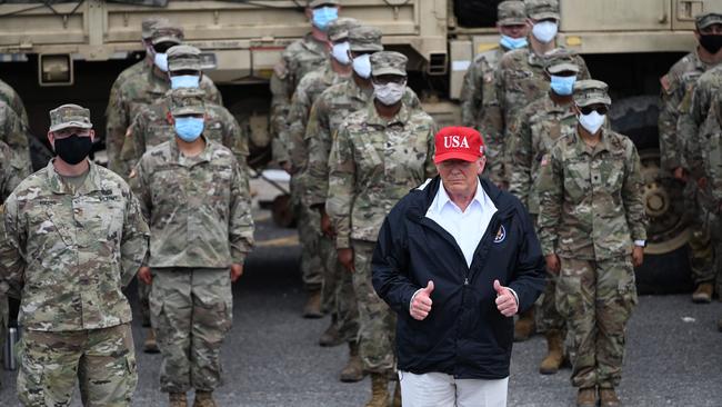 Donald Trump poses with National Guard troops in Lake Charles, Louisiana in August/ Picture: AFP