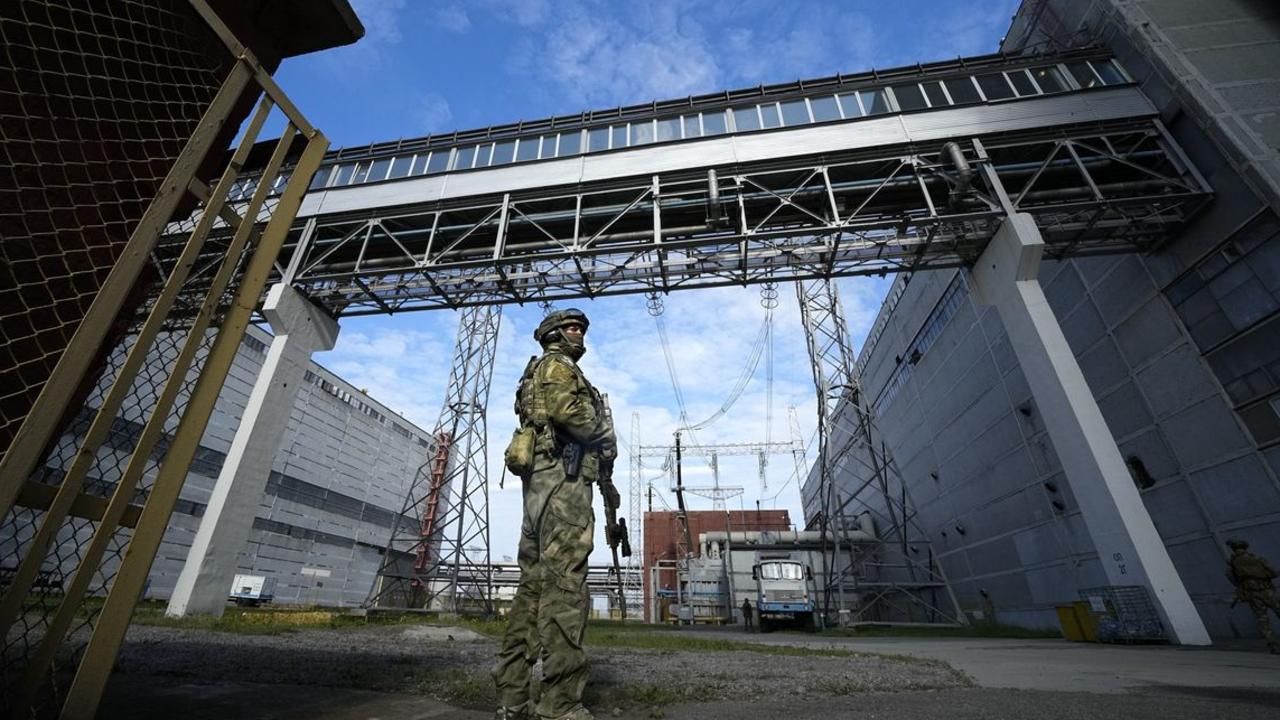 Russian troops at the nuclear station in the Zaporizhzhia region. PHOTO: ASSOCIATED PRESS