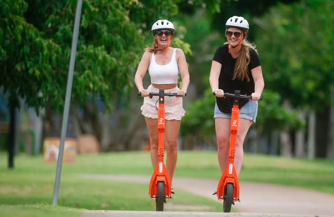 E-scooter fans Laura Nicklin and Rachel Attley cruising through Darwin CBD. Picture: Glenn Campbell