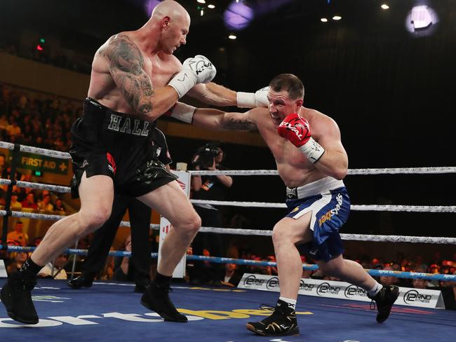 Paul Gallen and Barry Hall exchange blows on Friday night. Picture: Michael Klein