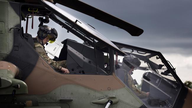 ‘Potentially lethal’ ... Prince Harry, left, pictured in a Tiger helicopter at Robertson Barracks in April. Picture: Getty Images