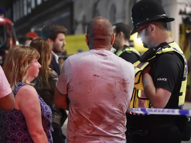 People speak with police officers after the latest terror atrocity in London. Picture: Reuters/Hannah McKay