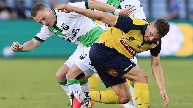 Gianni Stensness, playing for the Mariners, is tackled by United’s Besart Berisha.