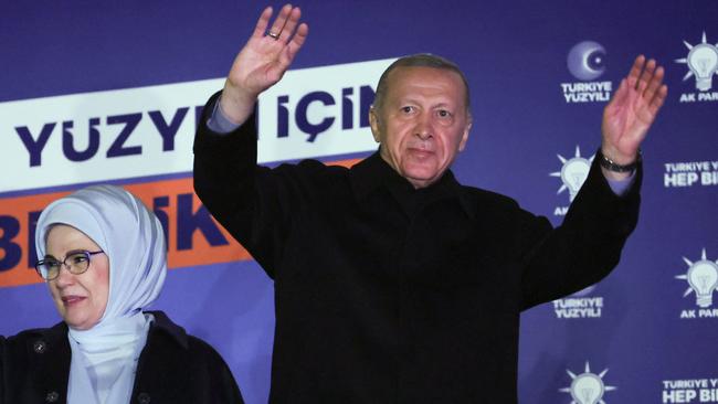 Turkish President Tayyip Erdogan with his wife Ermine acknowledge supporters at the AK Party headquarters in Ankara. Picture: AFP