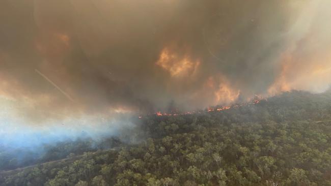 QFES aircrews captured this photos of a bushfire burning at Deepwater on Sunday where several properties were evacuated and some roads closed.