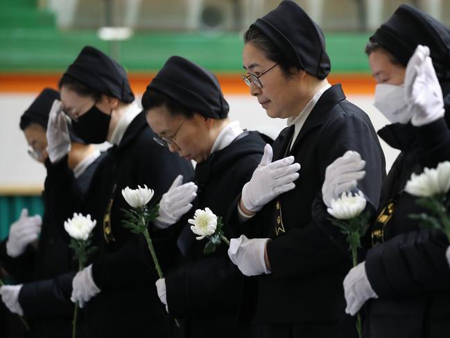 South Korean nuns pay tribute at a group memorial altar for victims of Flight 7C2216 at the Muan sport park December 30, 2024 in Muan-gun. Picture: Chung Sung-Jun/Getty Images