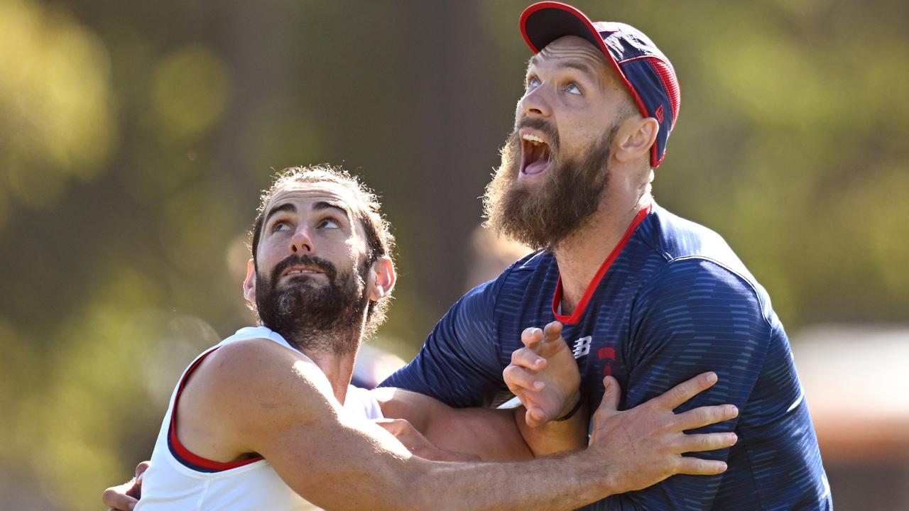 MELBOURNE, AUSTRALIA - MARCH 17: Brodie Grundy and Max Gawn of the Demons compete in the ruck during a Melbourne Demons AFL training session at Gosch's Paddock on March 17, 2023 in Melbourne, Australia. (Photo by Morgan Hancock/Getty Images)