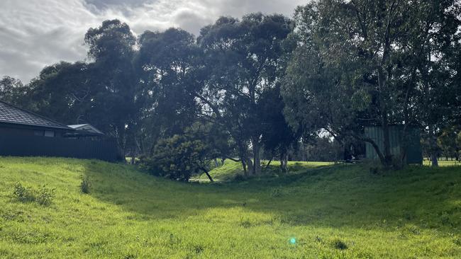 The dry creek bed that could become an emergency access point.