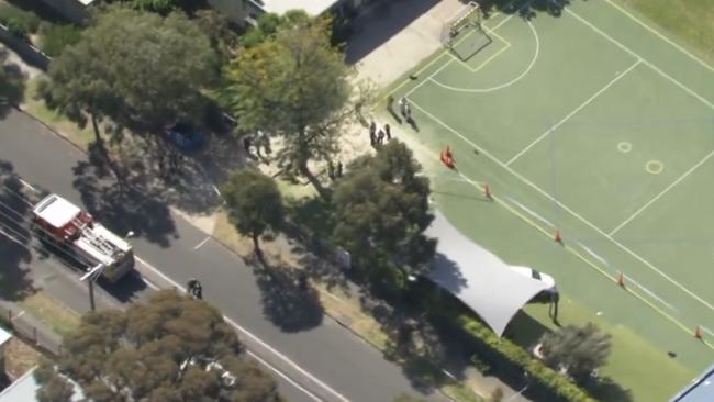 The scene where the car smashed through the school fence.