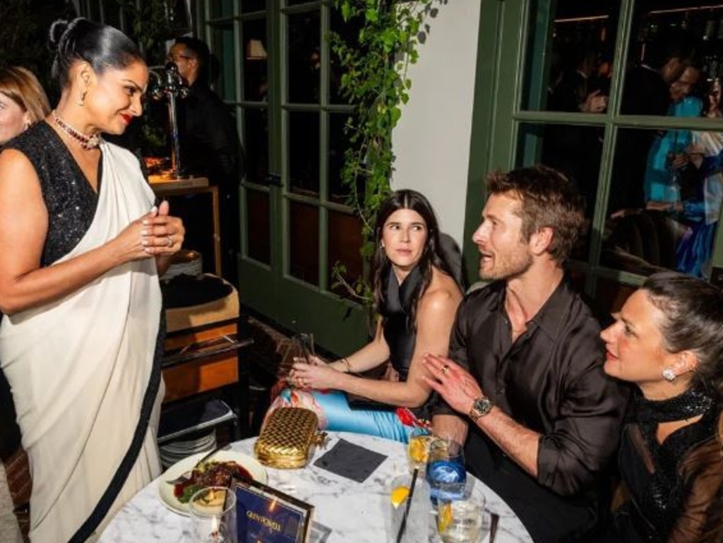 Hollywood's new favourite leading man, Glen Powell, is surrounded by admirers at a Globes after-party. Picture: Getty Images