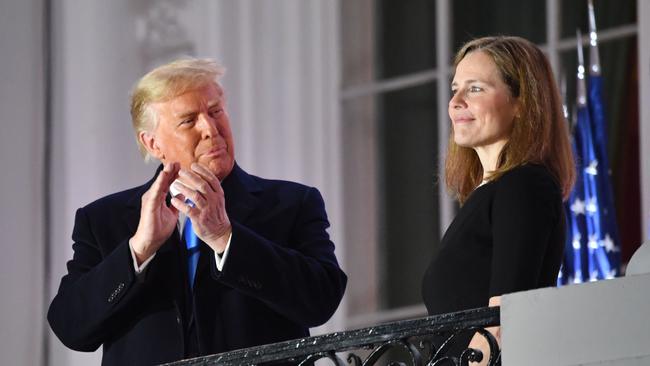 US President Donald Trump applauds Judge Amy Coney Barrett after she was sworn in as a US Supreme Court Associate Justice. Picture: AFP