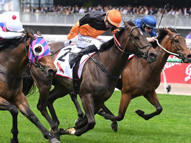 MELBOURNE, AUSTRALIA - NOVEMBER 02: Jordan Childs riding Maharba defeats Jye McNeil riding Rey Magnerio (L) and Charm Stone (r) in Race 3, the G.h. Mumm Rising Fast Stakes - Betting Odds  during 2024 Penfolds Victoria Derby Day at Flemington Racecourse on November 02, 2024 in Melbourne, Australia. (Photo by Vince Caligiuri/Getty Images)