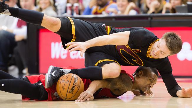 Matthew Dellavedova hits the deck while chasing a loose ball. Picture: Getty Images