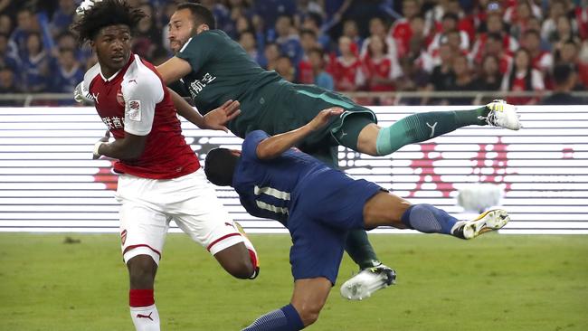 Chelsea's Pedro collides with Arsenal goalkeeper David Ospina.