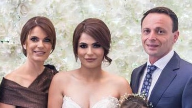 Kayla Itaoui (middle) with her parents Rachel and Ray Itaoui, on her wedding day. Picture: Facebook