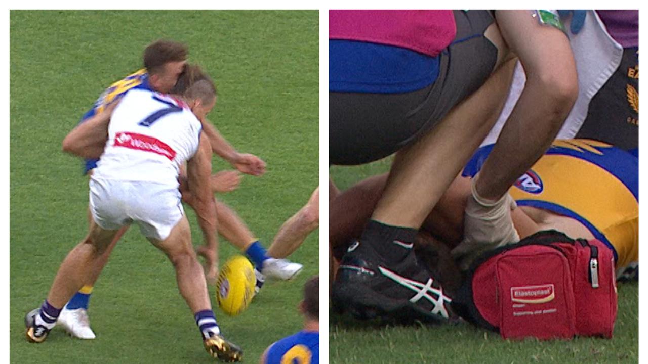 Zac Langdon was taken off the ground after this nasty headclash with Nat Fyfe.