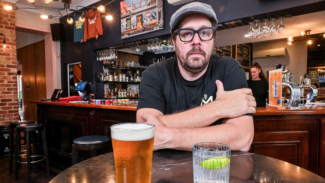 Gilbert Street Hotel publican Luke Saturno at the bar with a beer and a gin and tonic. Picture: NCA NewsWire/Brenton Edwards.