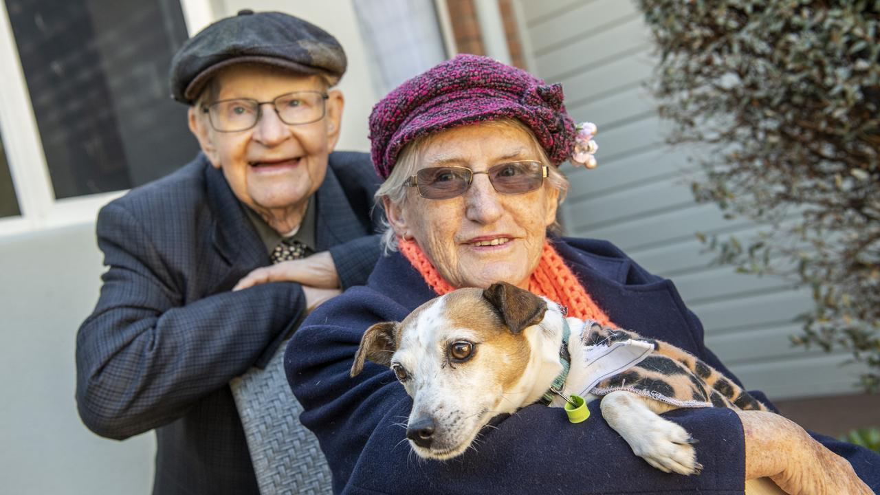 Toowoomba Care Services resident Mary Lester loved the visiting RSPCA dog Freckles so much she adopted him. She is pictured with her husband Vince Lester. Picture: Nev Madsen.