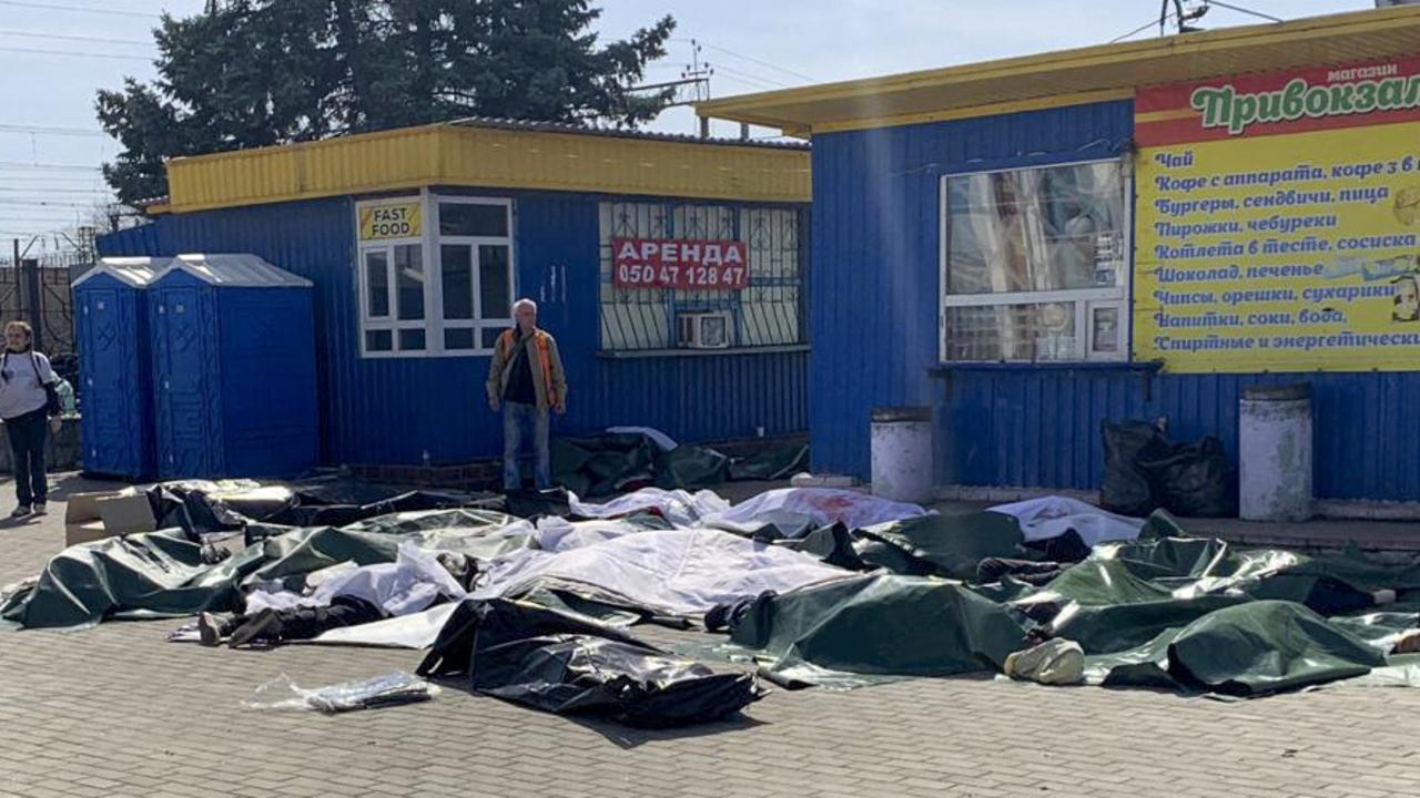 Casualties are laid out next to a platform. Picture: AFP