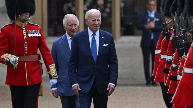 US President Joe Biden (3L) and Britain's King Charles III (2L) inspect the Guard of Honour during a ceremonial welcome in the Quadrangle at Windsor Castle. Picture: AFP