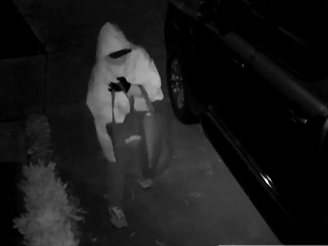 A Kurunjang resident was baffled after CCTV captured a disguised figure placing what appeared to be animal poo under his car tyres.