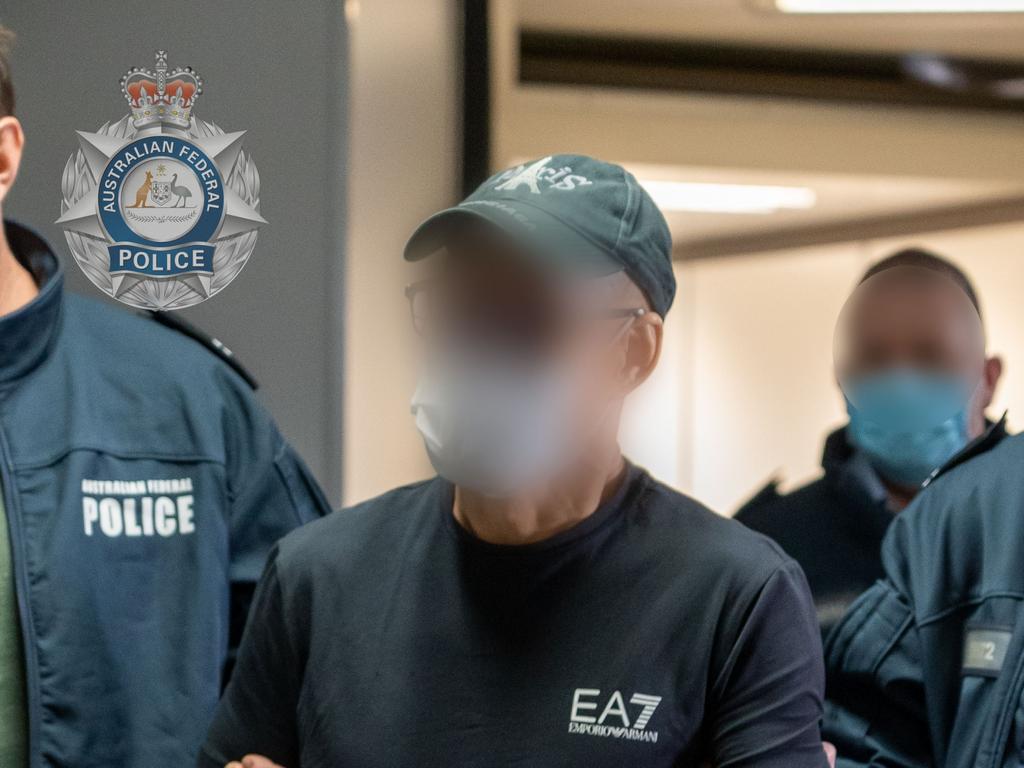Australian Federal Police escort Chung Chak Lee at Melbourne airport on Saturday June 11. Pic: Supplied.
